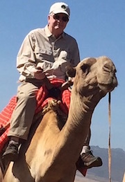 Ed riding a camel